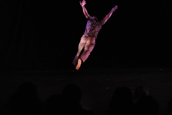 Boris Willis leaping, legs tucked beneath him